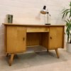 Mid Century Schreibtisch, Bähre Design, 1960's, Ulme, Rüster, Kirschbaum, hell, verschließbar, Vintage, Designklassiker, beidseitig, Bücherablage, Rückseite, Schubladen, konische Füße, Mignon Möbel