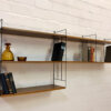 WHB "String-Regal", 1960's Nussbaum, Leiterregal, Mid Century, breit, Bücherregal, Wandregal, Designklassiker, schwarze Metall-Leitern, braun